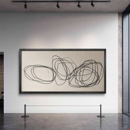 Abstract art piece on a wall in a gallery setting