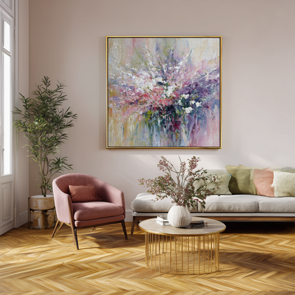 Modern living room with a pink armchair, white sofa, and abstract painting on the wall.